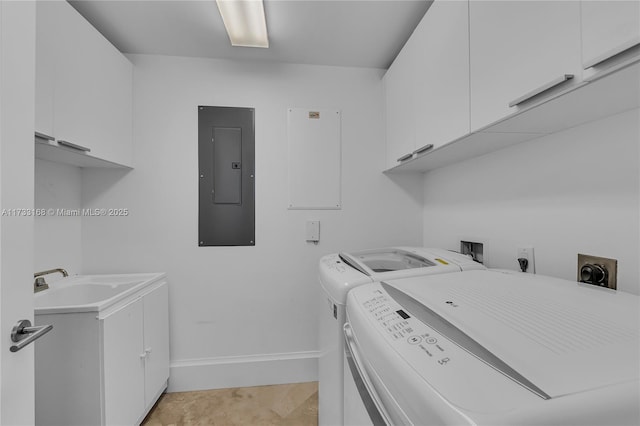 laundry area with sink, electric panel, cabinets, and independent washer and dryer