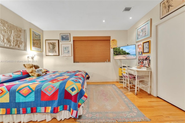 bedroom featuring hardwood / wood-style flooring