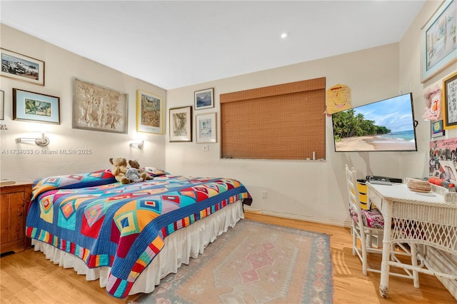 bedroom featuring hardwood / wood-style flooring