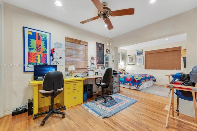 office space featuring ceiling fan and light hardwood / wood-style flooring