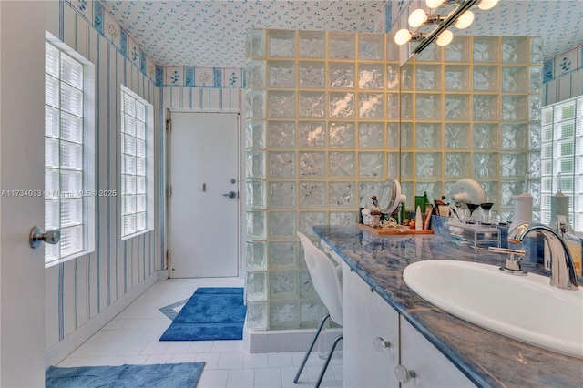 bathroom featuring vanity, tile patterned floors, a chandelier, and walk in shower