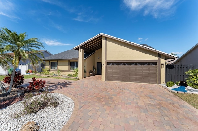 ranch-style home with a garage