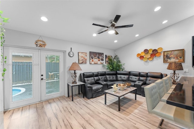 living room with ceiling fan, light wood-type flooring, and french doors