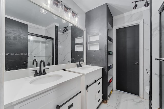 bathroom featuring an enclosed shower, vanity, and toilet