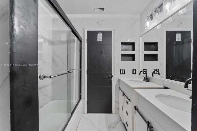 bathroom with vanity, crown molding, and shower / bath combination with glass door