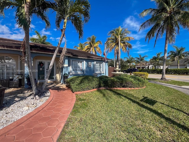 ranch-style home with a front yard