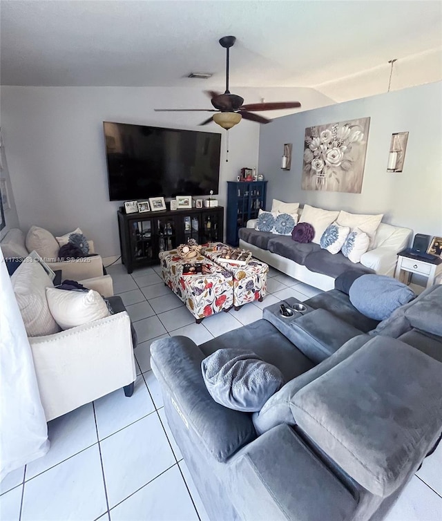 living room featuring light tile patterned floors and ceiling fan