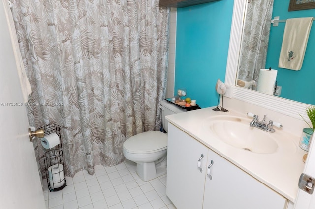 bathroom featuring tile patterned flooring, vanity, and toilet