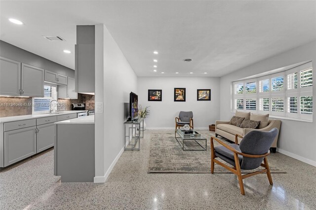 kitchen with french doors, sink, stainless steel electric range, and gray cabinetry