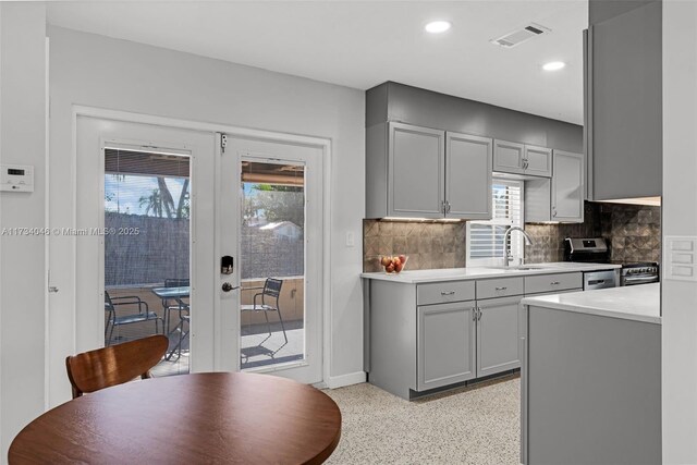 kitchen featuring tasteful backsplash and stainless steel fridge