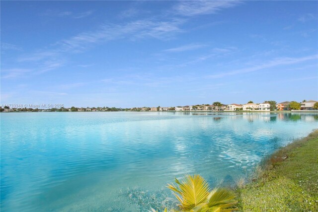 view of yard with a patio and a water view