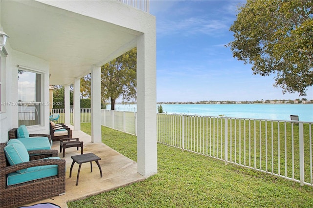 view of yard featuring a water view and a patio area