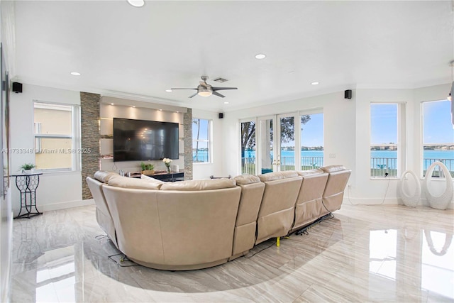 living room featuring crown molding, french doors, and ceiling fan