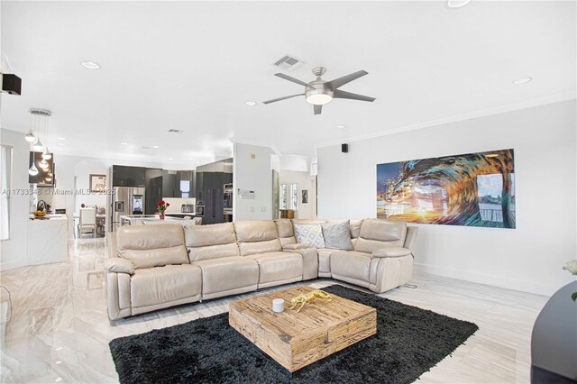 living room with crown molding and ceiling fan