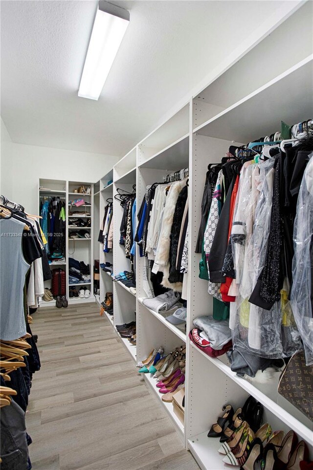 bedroom with ceiling fan and a closet