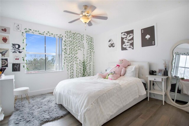 bedroom featuring wood-type flooring, a closet, and ceiling fan