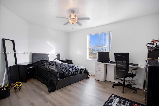 bedroom with ceiling fan and light hardwood / wood-style flooring