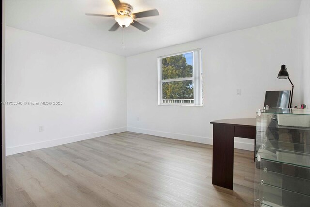 corridor with hardwood / wood-style flooring