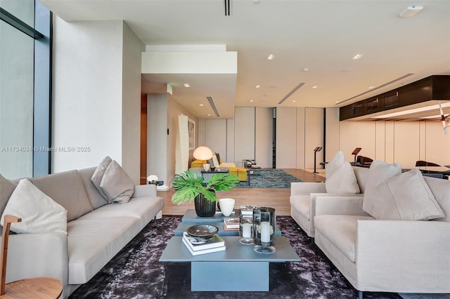 living room with floor to ceiling windows