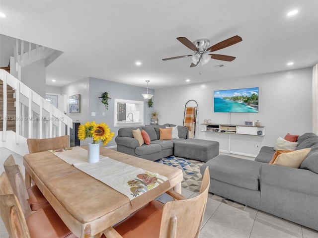 living room with light tile patterned floors and ceiling fan