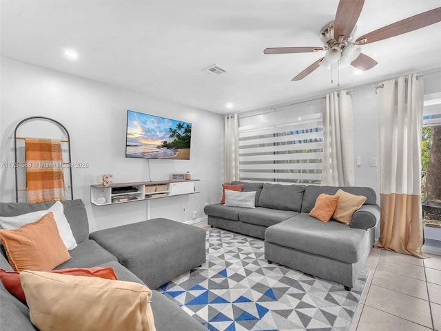 living room featuring ceiling fan and light tile patterned flooring