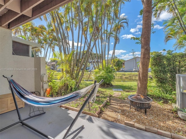 view of patio / terrace with a fire pit