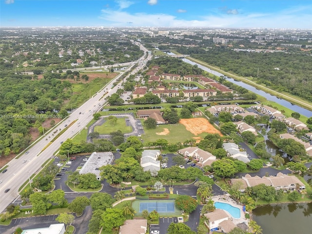 birds eye view of property with a water view