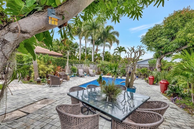 view of patio / terrace featuring a fenced in pool