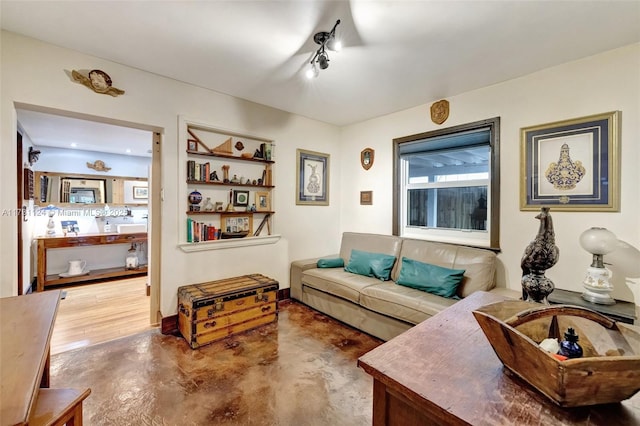 living room with concrete flooring