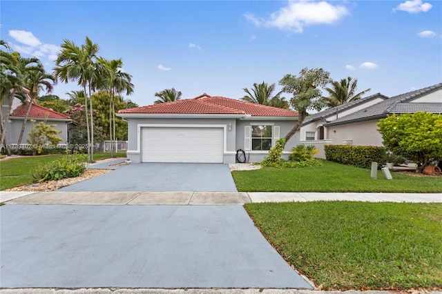 view of front of home featuring a garage and a front lawn