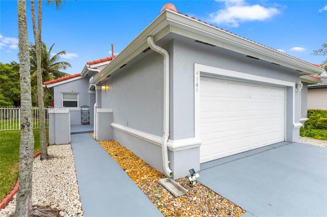 view of side of property featuring a garage