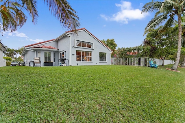 rear view of house with a lawn