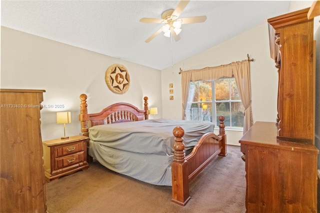 bedroom with dark carpet, vaulted ceiling, and ceiling fan