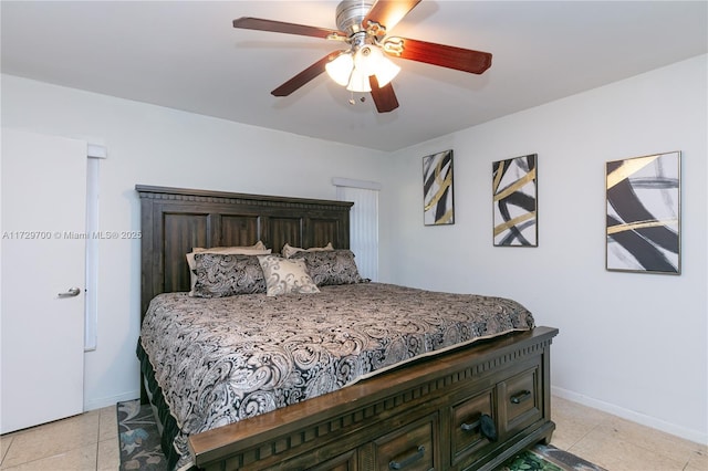 bedroom featuring light tile patterned flooring and ceiling fan