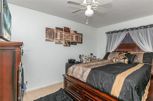 795 Banks Rd, Margate, FL 33063 - bedroom featuring light tile patterned floors, a textured ceiling, and a ceiling fan
