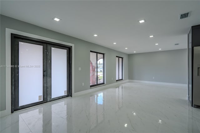 empty room featuring french doors