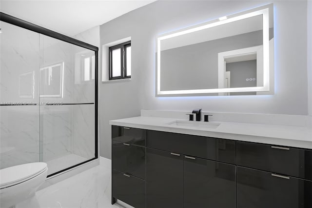 full bathroom with marble finish floor, vanity, a marble finish shower, and toilet