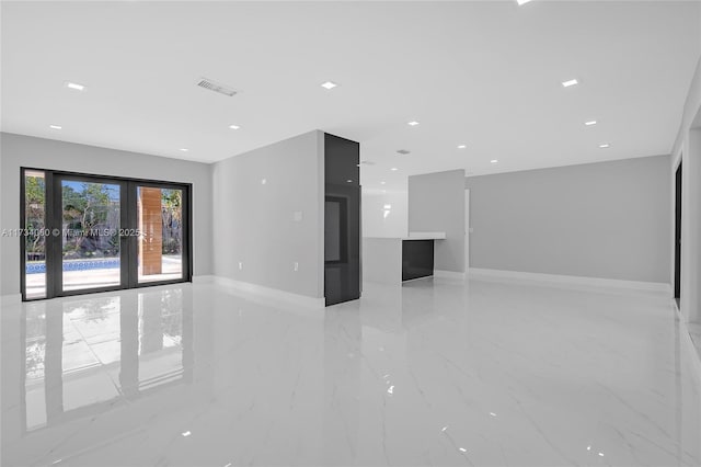 empty room with baseboards, visible vents, marble finish floor, french doors, and recessed lighting