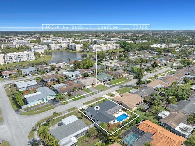 drone / aerial view featuring a water view