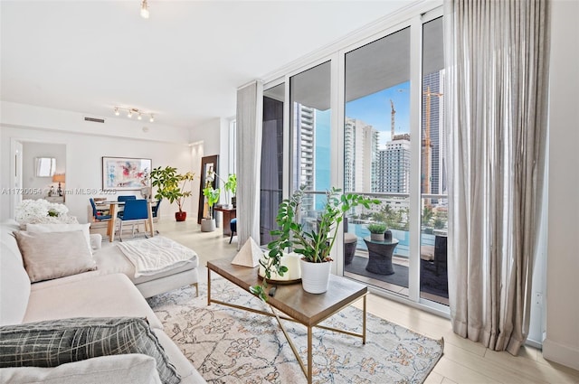 living room with floor to ceiling windows