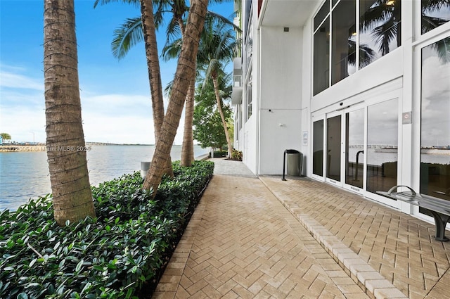 view of patio with a water view