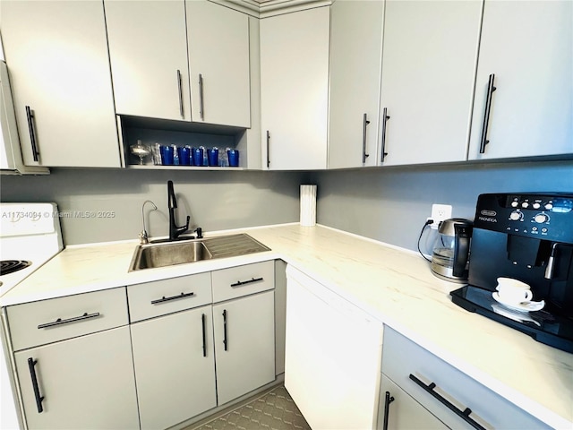 kitchen featuring dishwasher, sink, tile patterned floors, and white range with electric cooktop