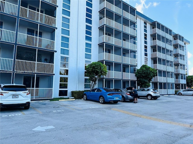 16950 W Dixie Hwy Unit A429, North Miami Beach, FL 33160 - view of apartment building / complex featuring uncovered parking