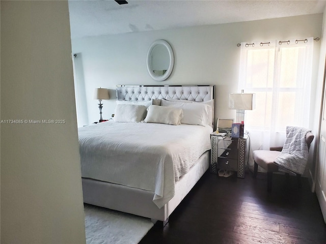 bedroom featuring dark hardwood / wood-style floors