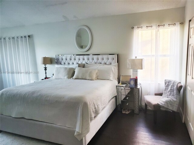 bedroom featuring dark hardwood / wood-style floors