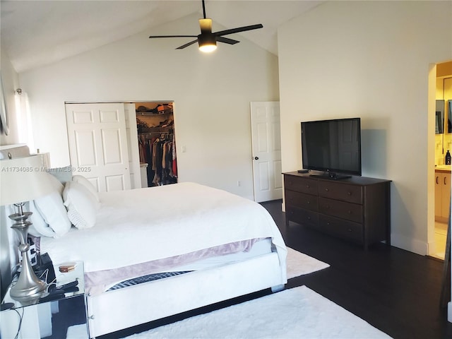 bedroom with lofted ceiling, dark hardwood / wood-style flooring, a closet, and ceiling fan