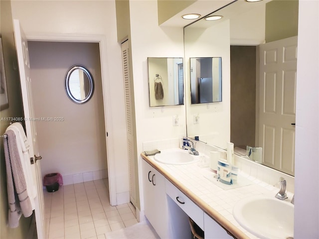 bathroom with vanity and tile patterned floors