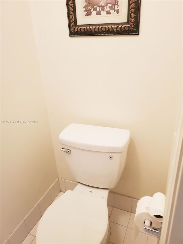 bathroom with tile patterned floors and toilet