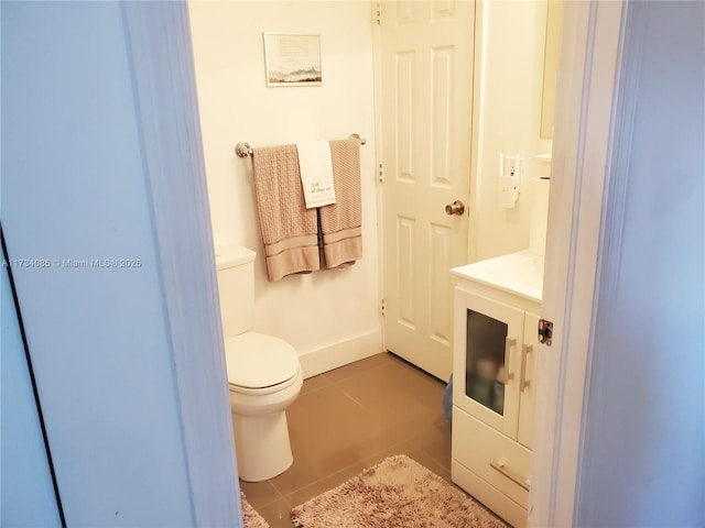 bathroom featuring tile patterned flooring and toilet