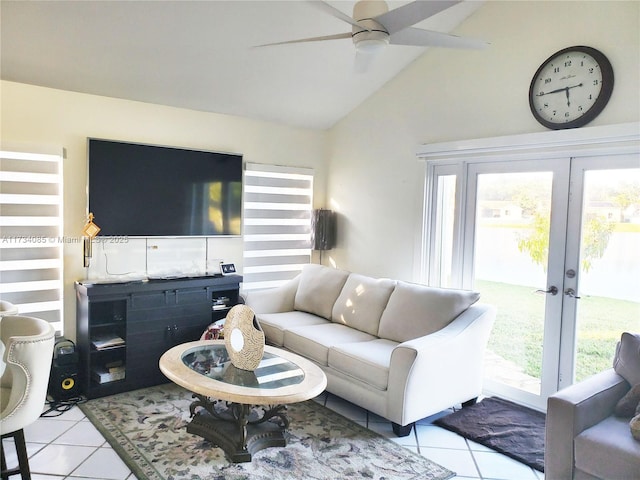 living room with light tile patterned flooring, ceiling fan, vaulted ceiling, and french doors